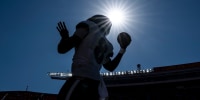 KANSAS CITY, MISSOURI - SEPTEMBER 28: Lamar Jackson #8 of the Baltimore Ravens looks to pass prior to an NFL football game against the Kansas City Chiefs at GEHA Field at Arrowhead Stadium on September 28, 2025 in Kansas City, Missouri. (Photo by Michael Owens/Getty Images)