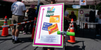 A sign advertising the acceptance of Supplemental Nutritional Assistance Program (SNAP) cards at a farmers market in Takoma Park, Maryland on July 9, 2025.