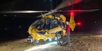 Rescuers prepare for rescue operations with a helicopter in search of five mountaineers, all German, who were hit by an avalanche Saturday afternoon, Nov. 1.