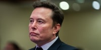Elon Musk listens as President Donald Trump speaks during a meeting with House Republicans at the Hyatt Regency hotel in Washington, D.C. on November 13, 2024.
