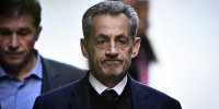 France's former president Nicolas Sarkozy leaves his residence to present himself to La Sante Prison for incarceration on a five-year prison sentence on Oct. 21.