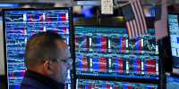 A trader works on the floor of the New York Stock Exchange.