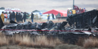 Wreckage is seen at the crash site of the Turkish C-130 military cargo plane