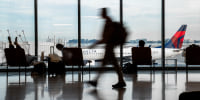 Passengers walk at the hall of San Francisco International Airport.