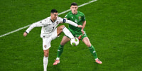Cristiano Ronaldo of Portugal against Dara O'Shea of Republic of Ireland