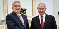 Russia's President Vladimir Putin and Hungary's Prime Minister Viktor Orban shake hands.
