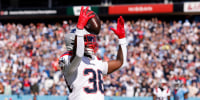 NASHVILLE, TENNESSEE - OCTOBER 19: Rhamondre Stevenson #38 of the New England Patriots celebrates after rushing for a touchdown against the Tennessee Titans during the third quarter of the game at Nissan Stadium on October 19, 2025 in Nashville, Tennessee. (Photo by Johnnie Izquierdo/Getty Images)