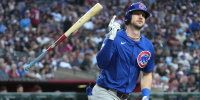 Mar 29, 2025; Phoenix, Arizona, USA; Chicago Cubs outfielder Kyle Tucker (30) hits a two-run home run against the Arizona Diamondbacks in the fifth inning at Chase Field. Mandatory Credit: Rick Scuteri-Imagn Images