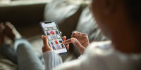 Woman purchasing clothes on a mobile app