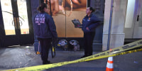 Members of the NYPD Crime Scene Unit investigate the scene after a robbery at 4Gseller in New York