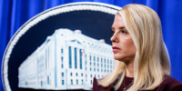 Pam Bondi in front of the Department of Justice seal