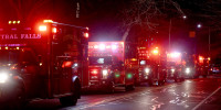 Ambulances line Hope Street at Brown University in Providence, R.I., Saturday, Dec. 13, 2025, during reports of a shooting.