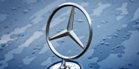 A Mercedes-Benz hood ornament.