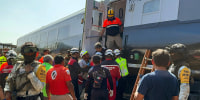 Mexican Army soldiers and Civil Protection members rescue passengers from the Interoceanic train that derailed in Nizanda, Oaxaca state, on the route to Coatzacoalcos, Mexico, on December 28, 2025. 