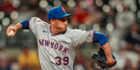 Aug 23, 2025; Cumberland, Georgia, USA; New York Mets relief pitcher Edwin Diaz (39) pitches against the Atlanta Braves during the ninth inning at Truist Park. Mandatory Credit: Dale Zanine-Imagn Images