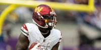 MINNEAPOLIS, MINNESOTA - DECEMBER 7: Deebo Samuel #1 of the Washington Commanders runs with the ball during an NFL football game against the Minnesota Vikings at U.S. Bank Stadium on December 07, 2025 in Minneapolis, Minnesota. (Photo by Michael Owens/Getty Images)