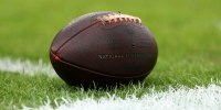 TAMPA, FLORIDA - NOVEMBER 9: A detailed view of an official Wilson NFL football on the grass field during an NFL football game between the Tampa Bay Buccaneers and the New England Patriots at Raymond James Stadium on November 9, 2025 in Tampa, Florida. (Photo by Kevin Sabitus/Getty Images)
