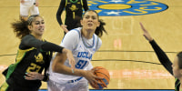 Dec 7, 2025; Los Angeles, California, USA; UCLA Bruins center Lauren Betts (51) drives past Oregon Ducks forward Sarah Rambus (23) for a basket during the first half at Pauley Pavilion presented by Wescom Financial. Mandatory Credit: Jayne Kamin-Oncea-Imagn Images