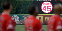 Jul 12, 2019; Anaheim, CA, USA; The Los Angeles Angels stand on the field for late pitcher Tyler Skaggs prior to the game against the Seattle Mariners at Angel Stadium of Anaheim. Mandatory Credit: Kelvin Kuo-USA TODAY Sports