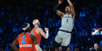 Dec 13, 2025; Las Vegas, Nevada, USA; San Antonio Spurs forward Victor Wembanyama (1) shoots the ball over Oklahoma City Thunder guard Alex Caruso (9) during the third quarter at T-Mobile Arena. Mandatory Credit: Kirby Lee-Imagn Images