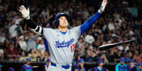 Los Angeles Dodgers Shohei Ohtani tosses his bat after hitting a three run home run against the Arizona Diamondbacks in the ninth inning at Chase Field in Phoenix on May 9, 2025.