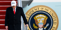 Donald Trump walks down the stairs of Air Force One 