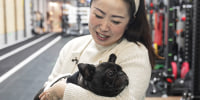Angela He with her dog in Beijing on Jan. 21, 2026.