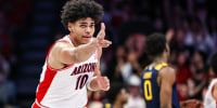Jan 24, 2026; Tucson, Arizona, USA; Arizona Wildcats forward Koa Peat (10) holds out a three after he makes a three-point basket during the first half of the game against the West Virginia Mountaineers at McKale Memorial Center. Mandatory Credit: Aryanna Frank-Imagn Images