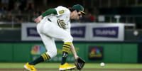 Sep 27, 2025; West Sacramento, California, USA; Athletics shortstop Jacob Wilson (5) fields a ball against the Kansas City Royals during the first inning at Sutter Health Park. Mandatory Credit: Dennis Lee-Imagn Images