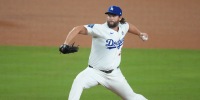 Oct 27, 2025; Los Angeles, California, USA; Los Angeles Dodgers pitcher Clayton Kershaw (22) throws during the twelfth inning against the Toronto Blue Jays in game three of the 2025 MLB World Series at Dodger Stadium. Mandatory Credit: Kirby Lee-Imagn Images