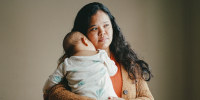 Maria Ibarra holds her baby
