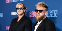 Logan Paul, left, and Jake Paul stand for portraits on the red carpet