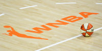 PALMETTO, FLORIDA - AUGUST 29: A basketball sits near the WNBA logo during a timeout of a game between the Las Vegas Aces and the New York Liberty at Feld Entertainment Center on August 29, 2020 in Palmetto, Florida. NOTE TO USER: User expressly acknowledges and agrees that, by downloading and or using this photograph, User is consenting to the terms and conditions of the Getty Images License Agreement. (Photo by Julio Aguilar/Getty Images)