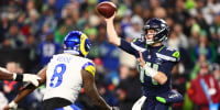 Jan 25, 2026; Seattle, WA, USA; Seattle Seahawks quarterback Sam Darnold (14) throws against Los Angeles Rams linebacker Jared Verse (8) during the second half in the 2026 NFC Championship Game at Lumen Field. Mandatory Credit: Kevin Ng-Imagn Images