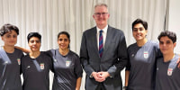 Australia's Home Affairs Minister Tony Burke poses with Fatemeh Pasandideh, Mona Hamoudi, Atefeh Ramezanizadeh, Zahra Ghanbari and Zahra Sarbali, the five women from the Iranian women’s soccer team who were granted humanitarian visas, in Queensland, Australia, March 9, 2026.