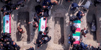 Iran holds a funeral ceremony for students and staff members of the Shajareh Tayyebeh girls' elementary school.