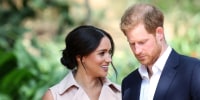 Meghan Markle, left, speaks to Prince Harry on her right