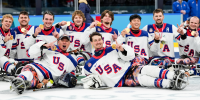 Team United States celebrates on the ice