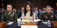 Director of the Defense Intelligence Agency Lt. Gen. James Adams III, Director of National Intelligence Tulsi Gabbard and Army Lt. Gen. William Hartman prepare to testify during a Senate hearing on March 18, 2026.
