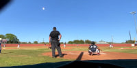 A meteor flies through the sky during a baseball game