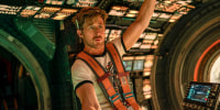 Ryan Gosling inside of a spacecraft cockpit