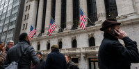 People walk outside of the New York Stock Exchange on March 19, 2026.