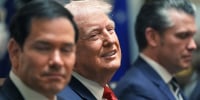 President Donald Trump is flanked by Secretary of State Marco Rubio, left, and Defense Secretary Pete Hegseth during a Cabinet meeting 