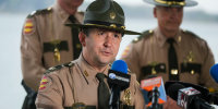 Major Travis Plotzer speaks during a Tennessee Highway Patrol press conference concerning a Clarksville-Montgomery County bus crash at Lake Halford in Huntingdon, Tenn., on Friday, Mar. 27, 2026.