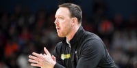 Siena Saints head coach Gerry McNamara claps Thursday, March 19, 2026, during the NCAA Men’s Basketball Tournament first round game against the Duke Blue Devils at Bon Secours Wellness Arena in Greenville, South Carolina.