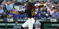 Sep 16, 2025; Pittsburgh, Pennsylvania, USA; Pittsburgh Pirates center fielder Oneil Cruz (15) hits an RBI triple against the Chicago Cubs during the first inning at PNC Park. Mandatory Credit: Charles LeClaire-Imagn Images