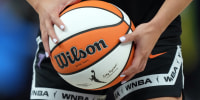 Aug 31, 2025; San Francisco, California, USA; Golden State Valkyries guard Kaitlyn Chen (2) holds a ball as the WNBA logo appears on the ball and shorts before the game against the Indiana Fever at Chase Center. Mandatory Credit: Darren Yamashita-Imagn Images