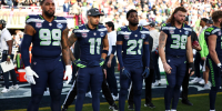 SANTA CLARA, CALIFORNIA - FEBRUARY 8: Leonard Williams #99, Jaxon Smith-Njigba #11, Devon Witherspoon #21# and Brady Russell #38 of the Seattle Seahawks stand on the sideline prior to the NFL Super Bowl LX football game against the New England Patriots, at Levi's Stadium on February 8, 2026 in Santa Clara, California. (Photo by Kevin Sabitus/Getty Images)