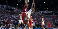 Mar 22, 2026; San Diego, CA, USA; St. John's Red Storm forward Zuby Ejiofor (24) shoots against Kansas Jayhawks center Paul Mbiya (34) in the first half during a second round game of the men's 2026 NCAA Tournament at Viejas Arena. Mandatory Credit: Kirby Lee-Imagn Images