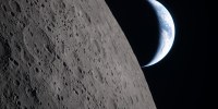 A crescent Earth setting along the Moon's limb